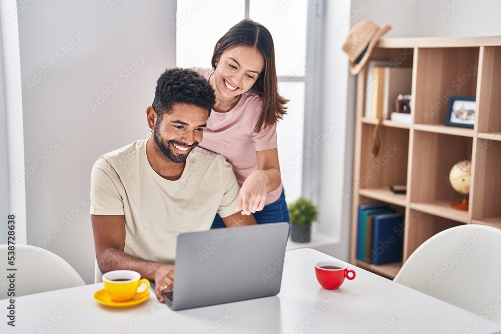 Sticker Man and woman couple sitting on table drinking coffee using laptop at home