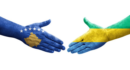 Handshake between Gabon and Kosovo flags painted on hands, isolated transparent image.