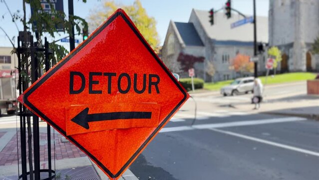 An orange DETOUR on West Beaver Avenue in downtown State College, Pennsylvania, home to Penn State's main campus.  	