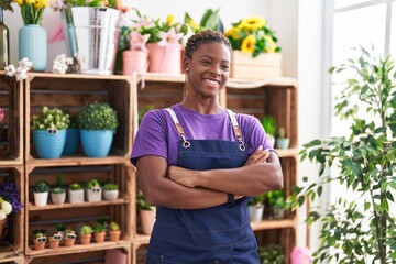 African american woman florist smiling confident standing with arms crossed gesture at florist