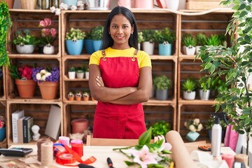 Young beautiful woman florist smiling confident standing with arms crossed gesture at florist