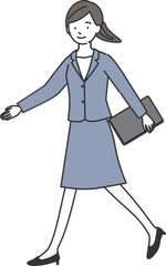 ノートパソコンを持って歩くスーツ姿の女性
