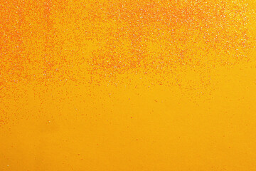 Shiny bright glitter on yellow background, flat lay. Space for text