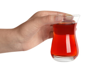 Woman holding glass of traditional Turkish tea on white background, closeup