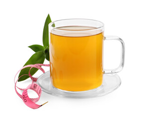 Fototapeta na wymiar Glass cup of diet herbal tea, measuring tape \and fresh leaves on white background. Weight loss