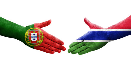 Handshake between Gambia and Portugal flags painted on hands, isolated transparent image.