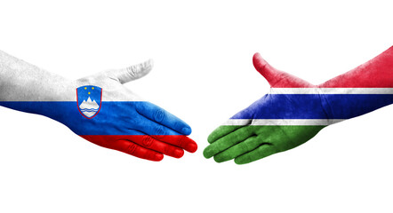 Handshake between Gambia and Slovenia flags painted on hands, isolated transparent image.