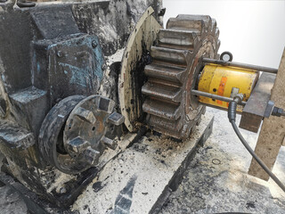 Large gears and cogs with bearing take out of machine to repair and clean the dirty trace of oil stain on shaft gear  bearings