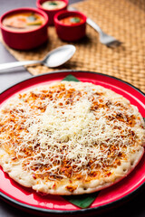 Cheese uttapam pizza, south Indian food with a twist. served with sambar and chutney