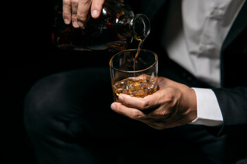 Barman pouring whiskey whiskey glass beautiful night