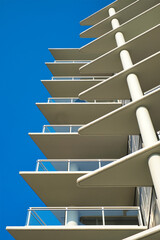 Obraz premium Abstract of modern architecture, walls made of concrete and glass balconies. Architecture details geometric abstract