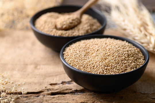 Brown quinoa seed in bowl on wooden background, Super food