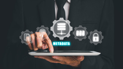 Metadata concept, Businessman touching on tablet with VR screen metadata icon on black background, Internet communication social network people concept.