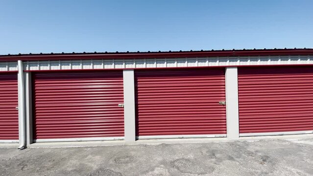 Driving by red self storage units.
