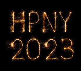 2023 (HPNY) happy new year fireworks celebration written sparkling at night.
