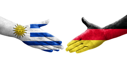 Handshake between Germany and Uruguay flags painted on hands, isolated transparent image.