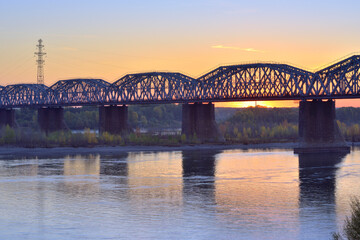 Bright dawn at the railway bridge