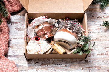 Christmas gift box with cookie mix and chocolate drink in a glass jar