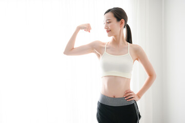 Beautiful Asian women doing muscle training, etc.