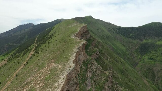 Aerial view of extreme rocky terrain with sharp edge. Mountain nature of Dagestan Republic. Nature of Goor village