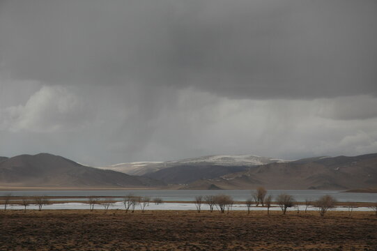 A tranquil steppe in the springtime, Zavkhan, Mongolia. The steppe is so vast. The river around it is still frozen in the month of April. The winter gets longer from October to April in Mongolia.