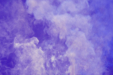 Beautiful flowing waves of smoke on blue background