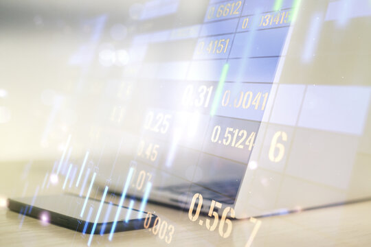 Double exposure of abstract creative financial diagram on modern laptop background, banking and accounting concept