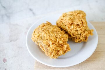 Fried chicken crisp, fast food meal on a white plate 