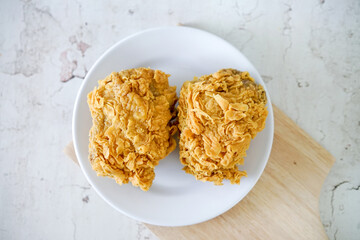 Fried chicken crisp, fast food meal on a white plate 