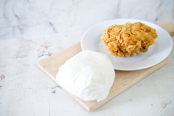 Fried chicken crisp with rice, fast food meal on a white plate 