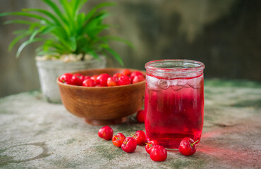 Glass of sour cherry juice with fresh red cherries, Cherry juice, on wood background, red drink, High vitamin C and antioxidant fruits.