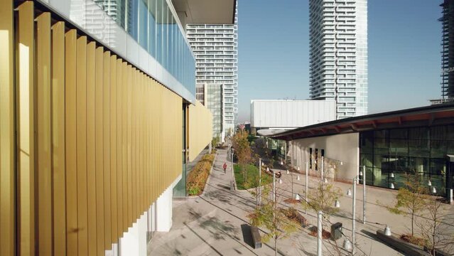 Beautiful buildings and architectural details of Vaughan Metropolitan Centre in Vaughan, Ontario, shown by low drone flight.