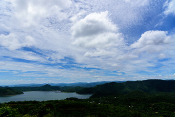 Fototapeta premium Mountain sky and river landscape view in kanchanaburi, thailand