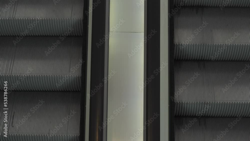 Aufkleber view from above of two moving escalators - close up