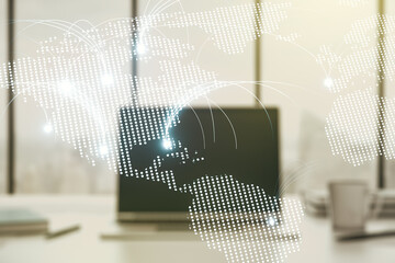 Double exposure of abstract digital world map with connections on laptop background, research and strategy concept