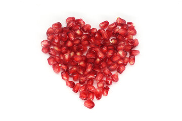 Fresh pomegranate fruits isolated against a white background
