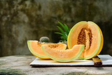 sliced of melons, fresh Melon or cantaloupe, Cantaloupe melons on wood background, Favorite fruit...