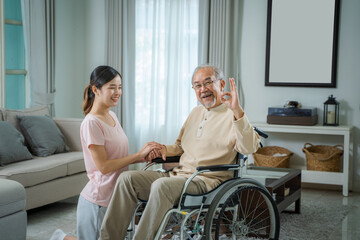 Fototapeta premium Daughter hold hand of father give comfort,Express health care sympathy at home,Concept senior people health care.