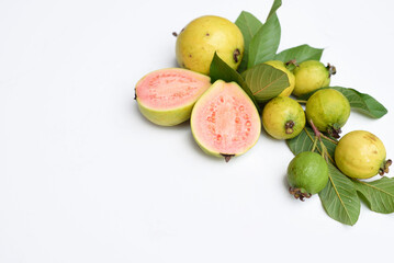 Naklejka na ściany i meble Ripe guava fruit with leaves on white background with copy space