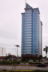 office building in the center of Jakarta city with a blue sky