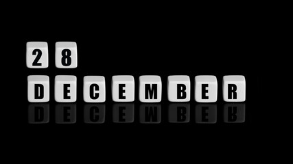 December 28th. Day 28 of month, Calendar date. White cubes with text on black background with reflection.Winter month, day of year concept