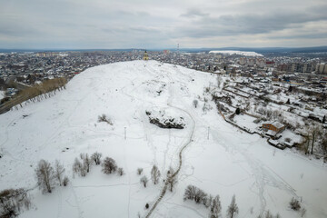 Fototapeta premium Flight over Lisya mountain or Fox mountain in the city of Nizhny Tagil, Russia. Aerial view