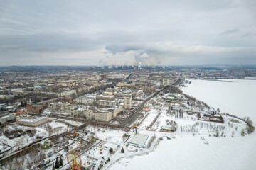 Winter view of the embankment of the city of Nizhny Tagil and the metallurgical plant from above. Environmental problem of environmental pollution and air in large cities