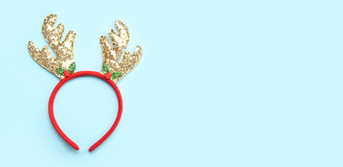 Christmas reindeer horns on light blue background with space for text © Pixel-Shot