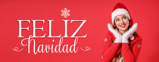 Pretty young woman in Santa hat and text FELIZ NAVIDAD (Spanish for Merry Christmas) on red...