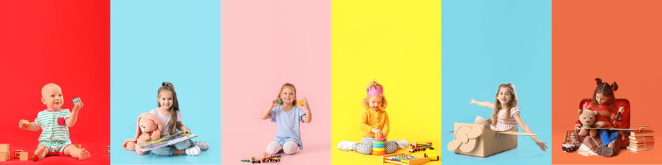 Group of little children with toys on color background