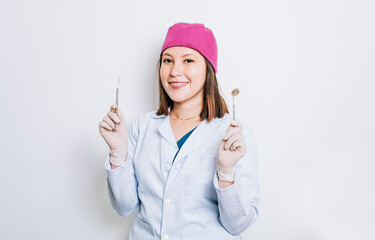 Portrait of a dentist woman holding dental tools, Dentist woman with mirror and dental probe on...