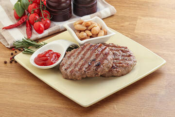 Grilled beef burger cutlet with sauce
