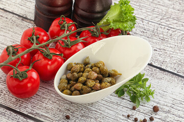 Marinated green capers in the bowl