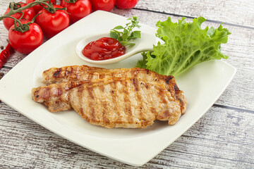 Grilled pork steak with ketchup